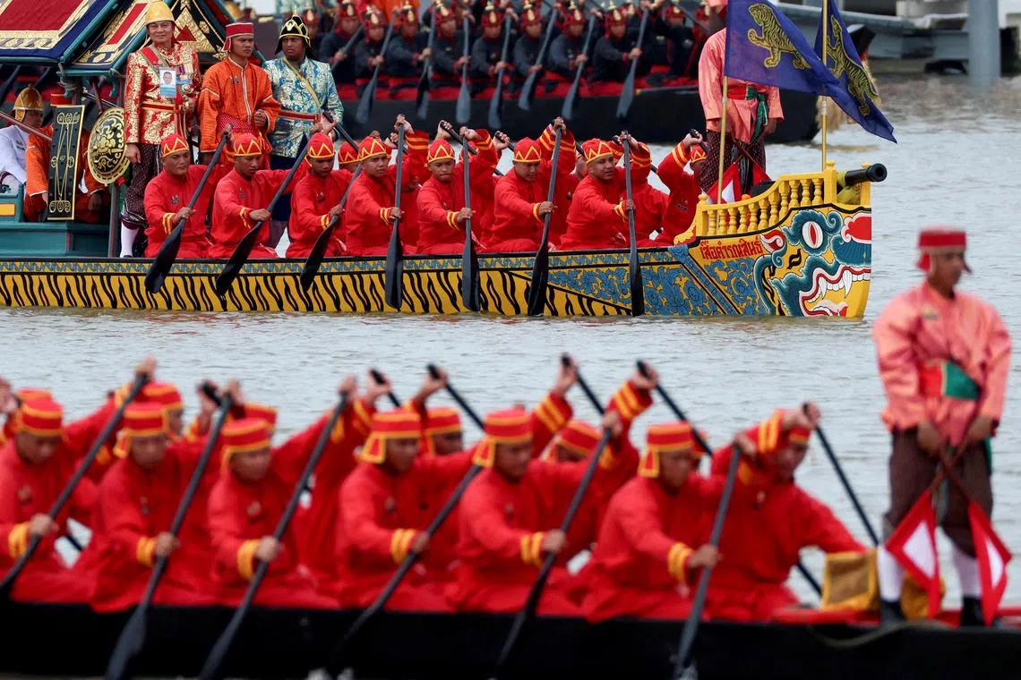 Thai oarsmen taking part in Thailand's King Maha Vajiralongkorn's royal barge procession to mark his 72nd birthday, along the Chao Phraya River in Bangkok, Thailand, on Oct 27, 2024. 