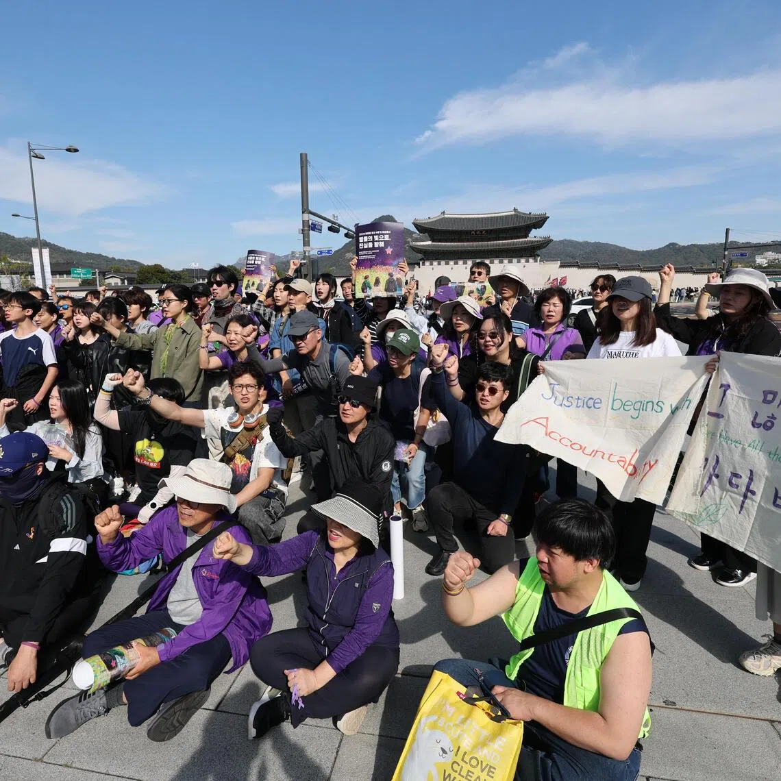 Bereaved families and citizens hold signs and chant slogans demanding a full investigation into the tragedy during a march to mark the fourth anniversary of the Itaewon crowd crush on Oct 17.