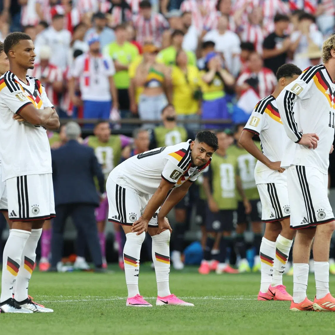 Soccer Football - FIFA World Cup 2026 - Round of 32 - Germany v Paraguay - Boston Stadium, Foxborough, Massachusetts, U.S. - June 29, 2026 Germany's Nick Woltemade, Malick Thiaw and Nadiem Amiri react after Germany's Jonathan Tah missed a penalty during a penalty shootout IMAGN IMAGES via Reuters/Amanda Perobelli