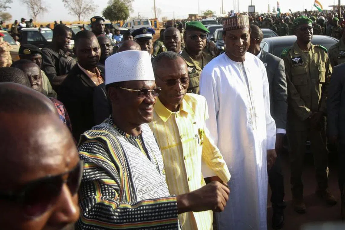 Prime Minister of Niger, Ali Mahamane Lamine Zeine, Prime Minister of Burkina Faso Apollinaire Joachim Kyelem de Tambela and Prime Minister of Mali Choguel Kokalla Maiga walk as they attend a sit-in in Niamey, Niger, December 29, 2023. REUTERS/Mahamadou Hamidou/File Photo