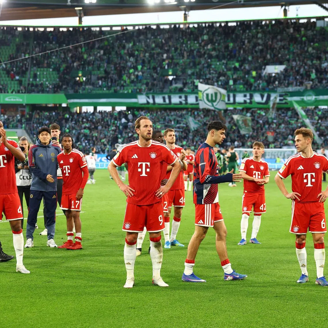 Soccer Football - Bundesliga - VfL Wolfsburg v Bayern Munich - Volkswagen Arena, Wolfsburg, Germany - May 9, 2026 Bayern Munich's Harry Kane, Jonathan Tah and Joshua Kimmich celebrate after the match REUTERS/Lisi Niesner