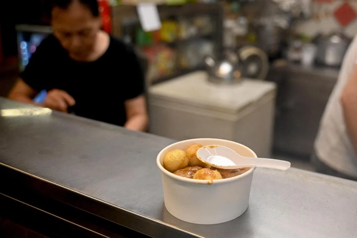 A bowl of fishballs served with a plastic spoon in Hong Kong. Plastic waste is the city's second-largest source of municipal solid waste.