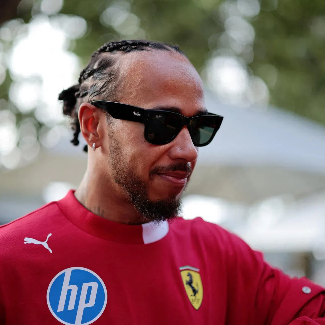 FILE PHOTO: Formula One F1 - Australian Grand Prix - Qualifying - Albert Park Grand Prix Circuit, Melbourne, Australia - March 15, 2025 Ferrari's Lewis Hamilton before practice REUTERS/Mark Peterson/File Photo