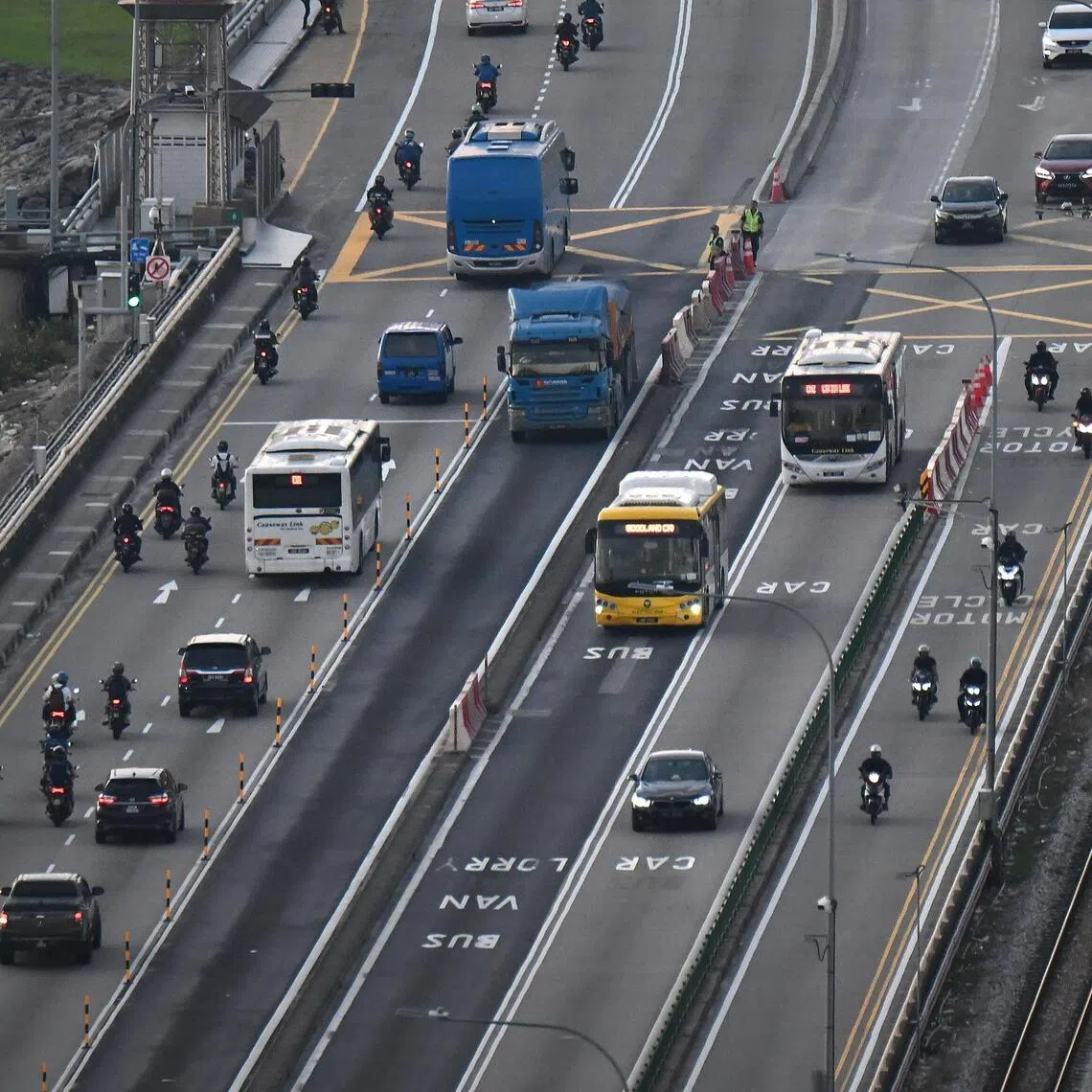 Cars, buses and motorcycles seen entering and leaving Johor from Singapore.