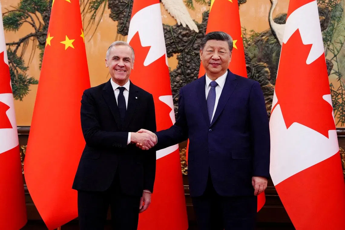 Canadian Prime Minister Mark Carney shakes hands with President of China Xi Jinping at the Great Hall of the People in Beijing, China on Friday, Jan. 16, 2026.  Sean Kilpatrick/Pool via REUTERS/File Photo