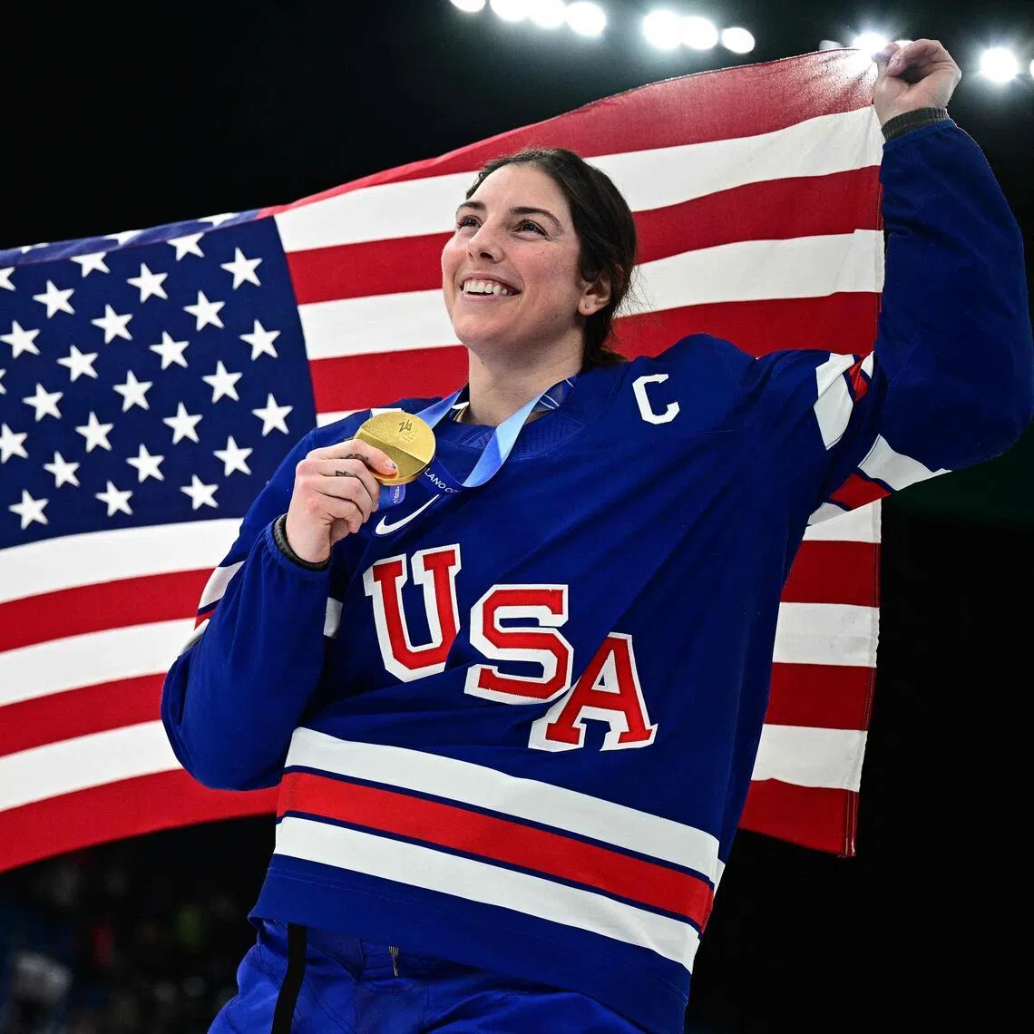 The US' Kendall Coyne (left) and Hilary Knight celebrating during the medal ceremony for the women's ice hockey event at the Milano Santagiulia Ice Hockey Arena during the 2026 Milano-Cortina Winter Olympic Games in Milan, on Feb 19, 2026.