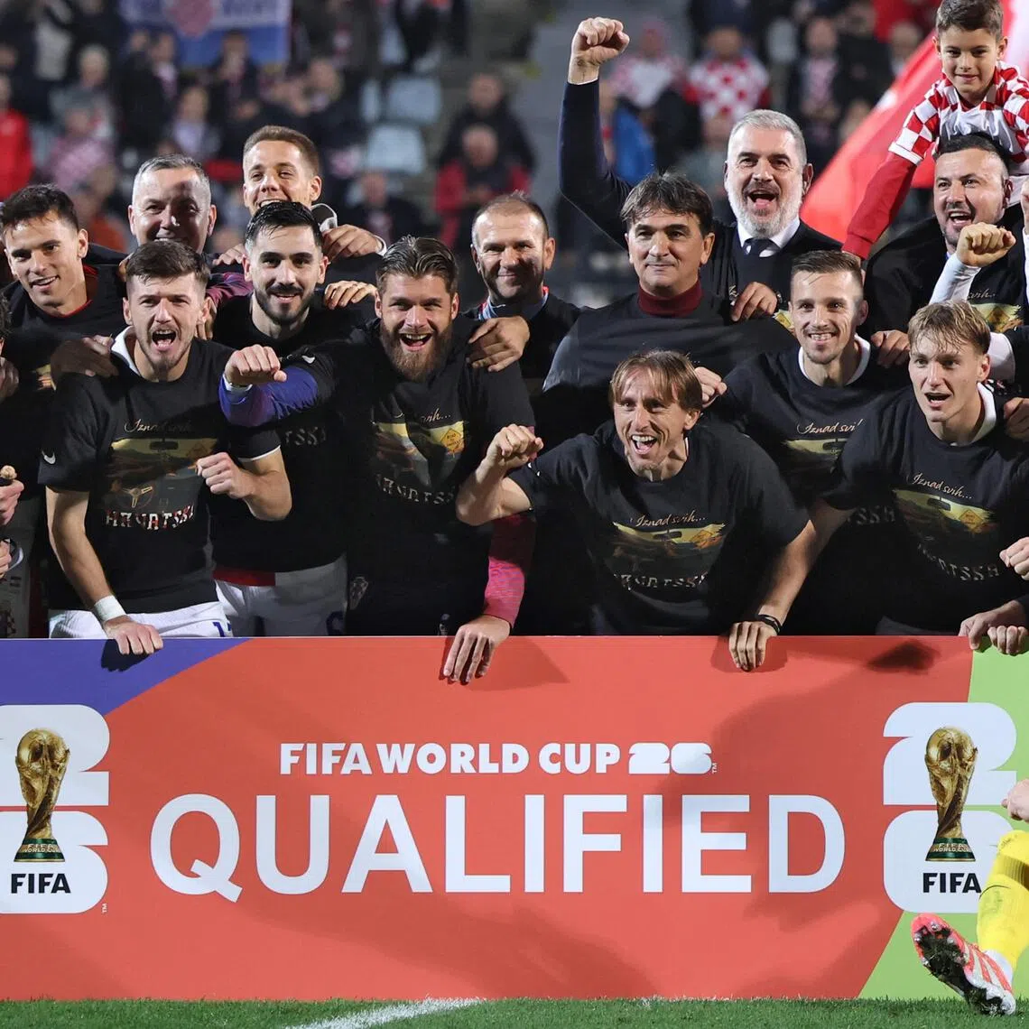 Croatian players, officials and their relatives celebrating their team's qualification for the World Cup on Nov 14.