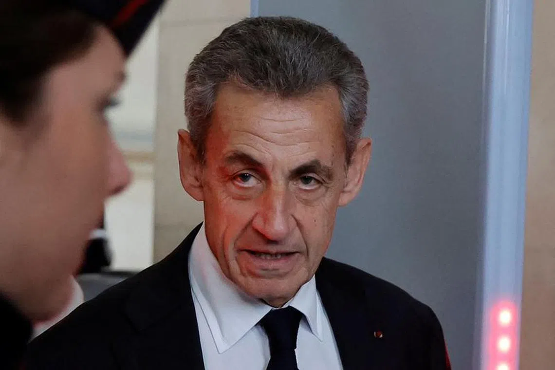 Former French President Nicolas Sarkozy arrives for his appeal trial on charges of corruption and influence peddling, at Paris courthouse, France, December 5, 2022. REUTERS/Pascal Rossignol/File Photo
