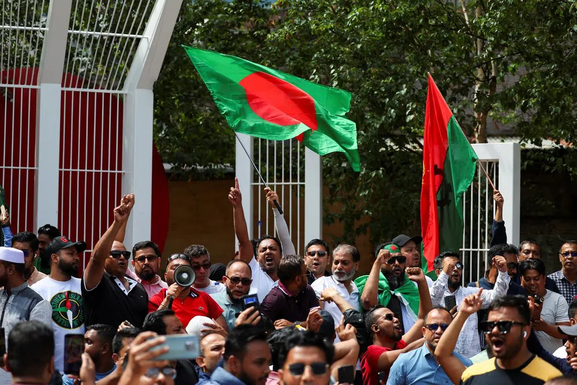 People from the British Bangladeshi community react following the resignation of Bangladeshi Prime Minister Sheikh Hasina, in a park in East London, Britain, August 5, 2024. REUTERS/Toby Melville