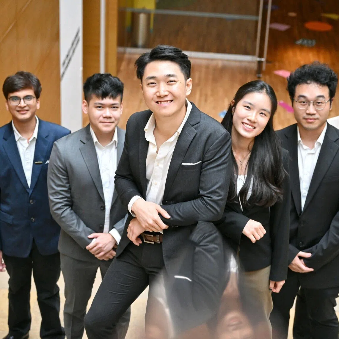 SMU students (from left) Saurabh Maskara, Kendrick Poon, Isaiah Chia, Arin Mak, Kevin Tan and Ryan Bangras developed a tool that aims to find young people facing issues. The tool clinched top prize at this year’s Dell InnovateFest.