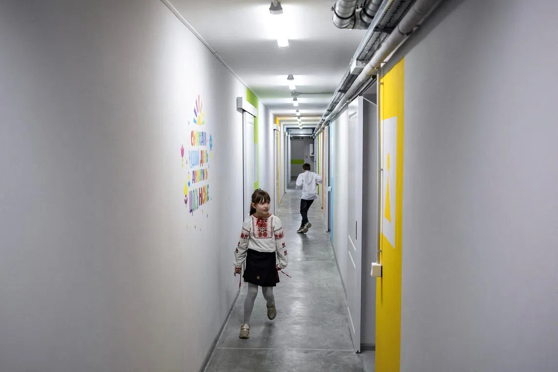 FILE PHOTO: Pupils attend a first day in the newly opened underground school that allows children to safely return to in-person studies, amid Russia's attack on Ukraine, in a remote part of the Osnovyansky district in Kharkiv, Ukraine April 21, 2025. REUTERS/Marko Djurica/File Photo