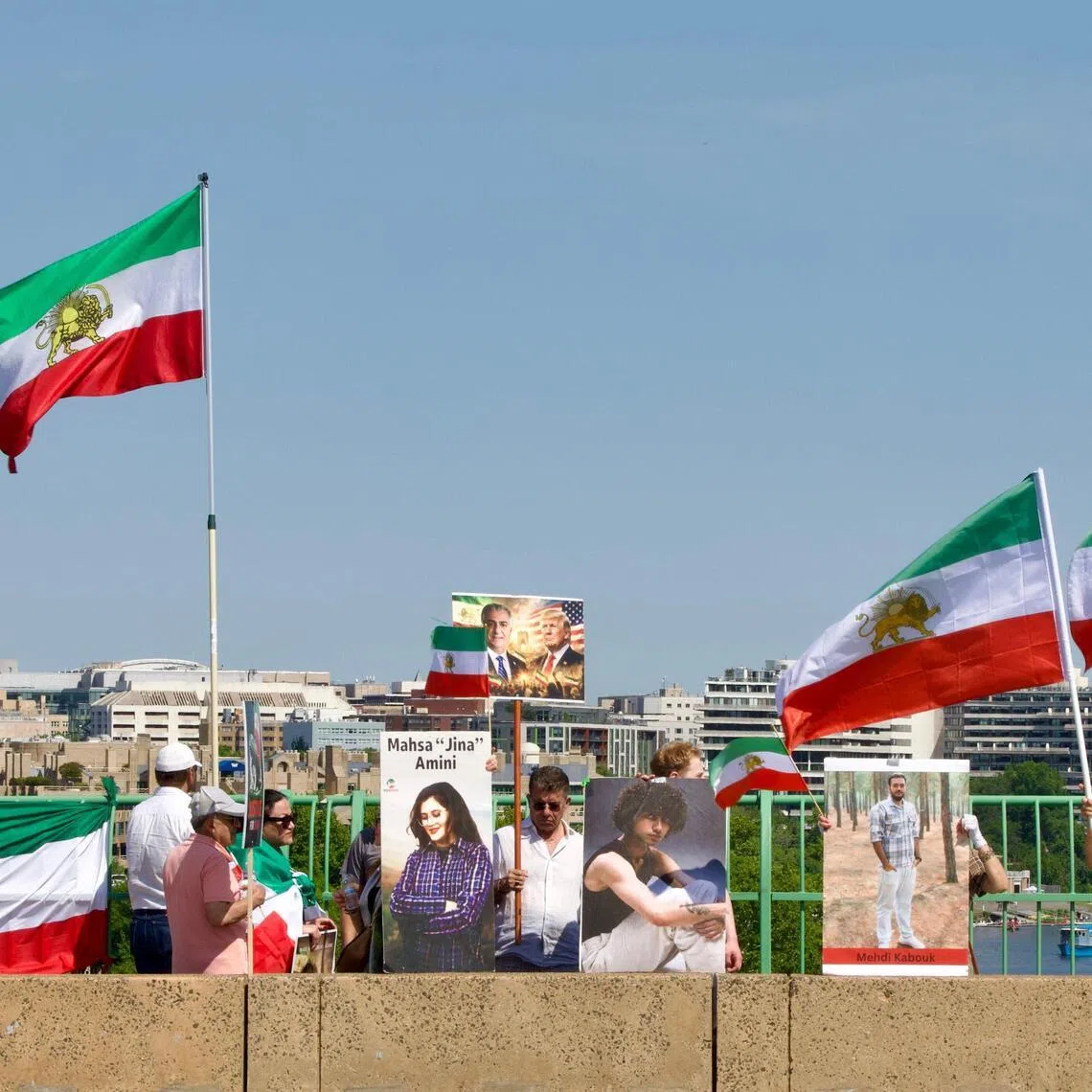 Demonstrators wave Iranian flags during a rally in support of the Iranian people and to condemn the execution of political prisoners in Iran, in Washington, DC, on May 16, 2026.