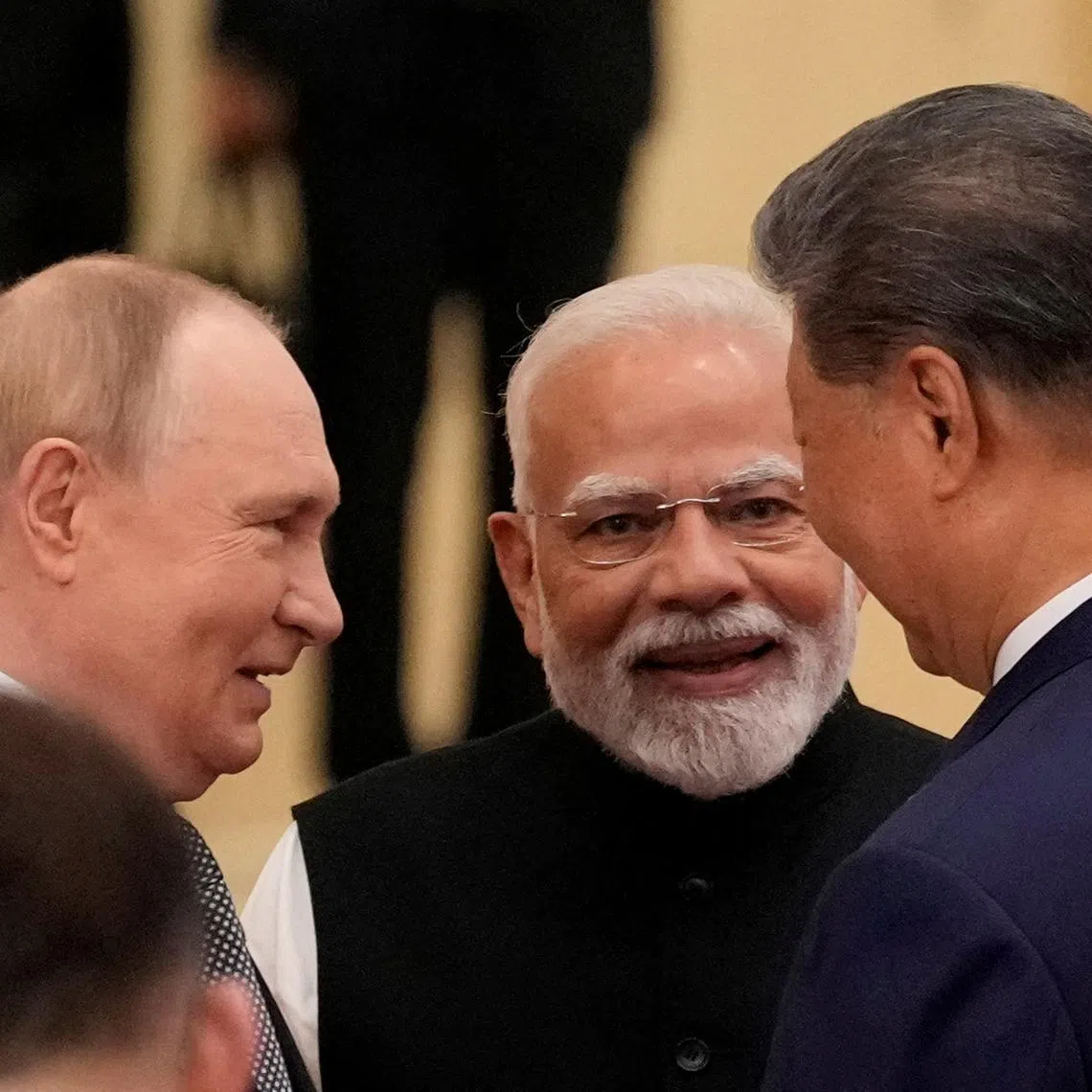 FILE PHOTO: Indian Prime Minister Narendra Modi talks with Russian President Vladimir Putin and Chinese President Xi Jinping ahead of the Shanghai Cooperation Organization (SCO) Summit 2025 at the Meijiang Convention and Exhibition Centre in Tianjin, China, September 1, 2025.  SUO TAKEKUMA/Pool via REUTERS/File Photo
