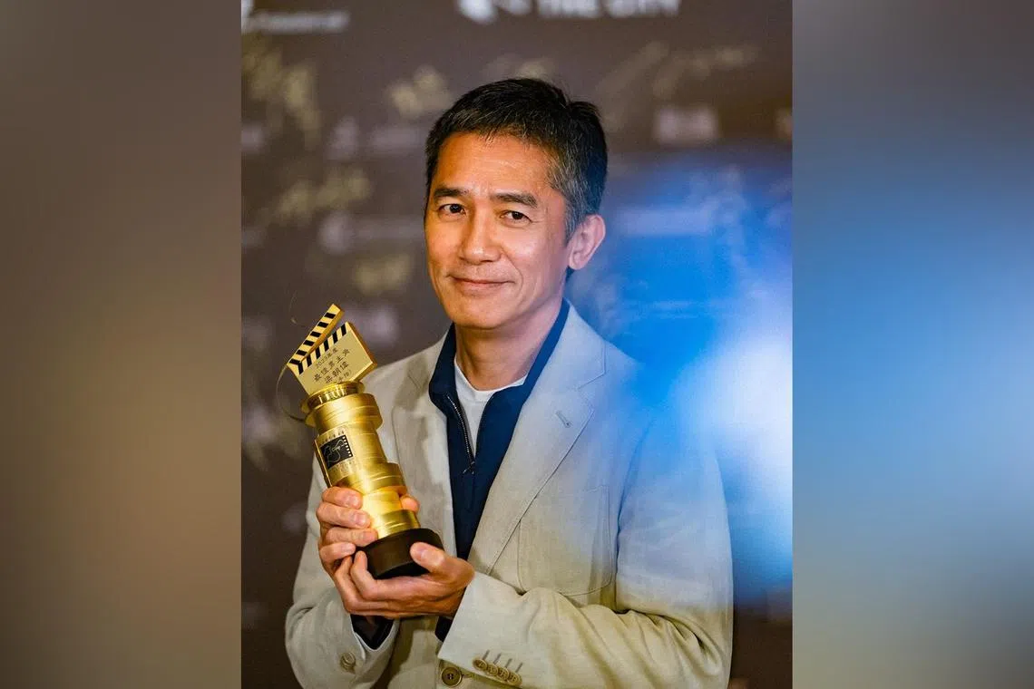 Tony Leung Chiu Wai with his award at the Hong Kong Film Directors’ Guild Awards.