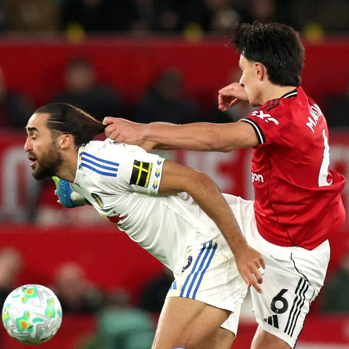 Soccer Football - Premier League - Manchester United v Leeds United - Old Trafford, Manchester, Britain - April 13, 2026 Manchester United's Lisandro Martinez fouls Leeds United's Dominic Calvert Lewin and is later shown a red card after a VAR review REUTERS/Phil Noble/File Photo