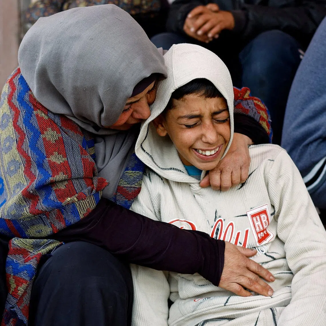 Mourners react during the funeral of Palestinians who, according to medics, were killed by Israeli strikes on Wednesday, at Al-Aqsa Martyrs Hospital, in Deir al-Balah, central Gaza Strip, January 21, 2026. REUTERS/Mahmoud Issa