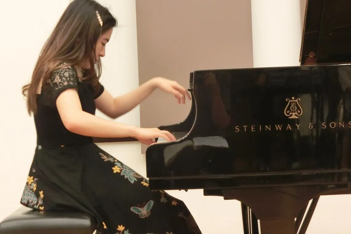 Cheryn Pandora was one of 23 students playing Debussy at the Yong Siew Toh Conservatory's concert. 
