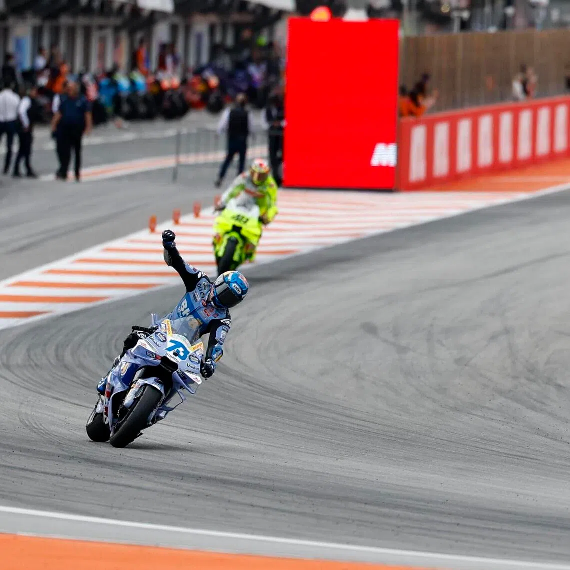 Spanish MotoGP rider Alex Marquez celebrates after winning the sprint race of the motorcyling Grand Prix of the Valencia Community at Ricardo Tormo track, in Cheste, Spain on Nov 15, 2025.