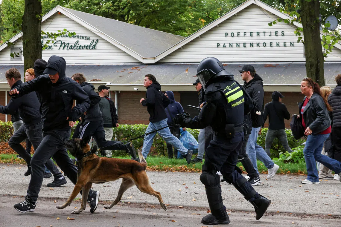 Police clash with far-right protesters in The Hague