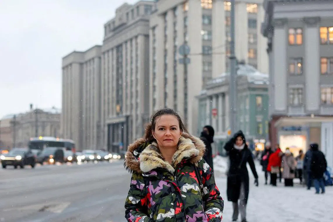 Maria Andreeva, whose husband was mobilised in October 2022 to join the Russian armed forces involved in a military campaign in Ukraine, poses for a picture in front of the headquarters of State Duma, the lower house of parliament, in central Moscow, Russia, November 30, 2023. REUTERS/Yulia Morozova