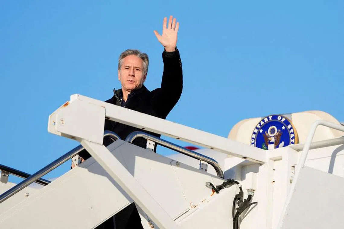 U.S. Secretary of State Antony Blinken waves as he boards a plane, en route to Saudi Arabia, as part of his fifth urgent trip to the Middle East since the war between Israel and the Palestinian Islamist group Hamas in Gaza erupted in October, at Joint Base Andrews, in Maryland, U.S., February 4, 2024. Mark Schiefelbein/Pool via REUTERS