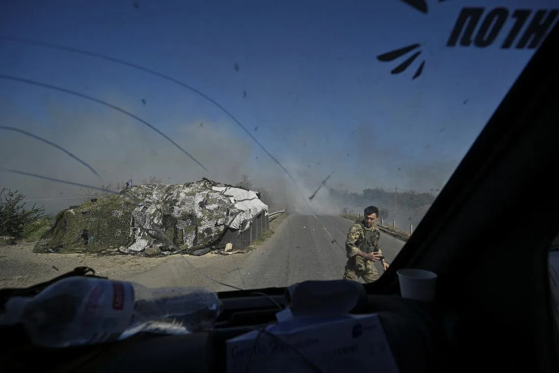 FILE PHOTO: A police officer stands on a road during an evacuation of civilians from the outskirts of the Kurakhove town, amid Russia's attack on Ukraine, in Donetsk region, Ukraine September 16, 2024. REUTERS/Stringer/File Photo