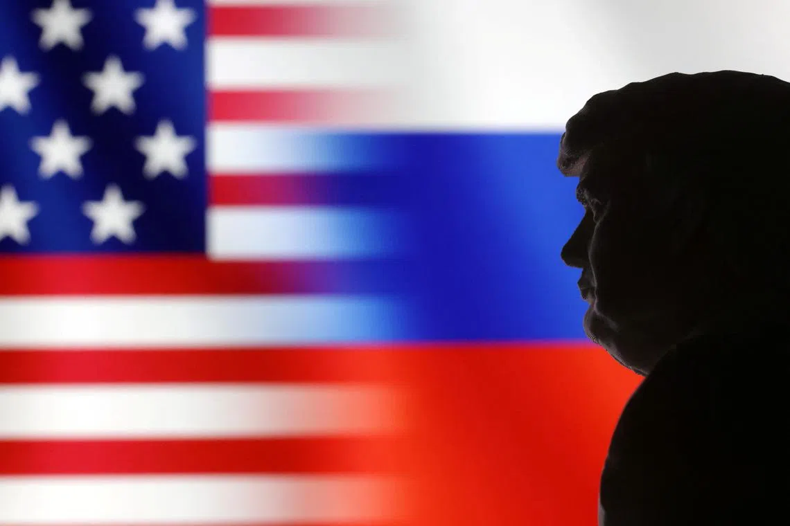 FILE PHOTO: A 3D-printed miniature model of U.S. President-elect Donald Trump, and the U.S. and Russian flags are seen in this illustration taken January 15, 2025. REUTERS/Dado Ruvic/Illustration/File Photo