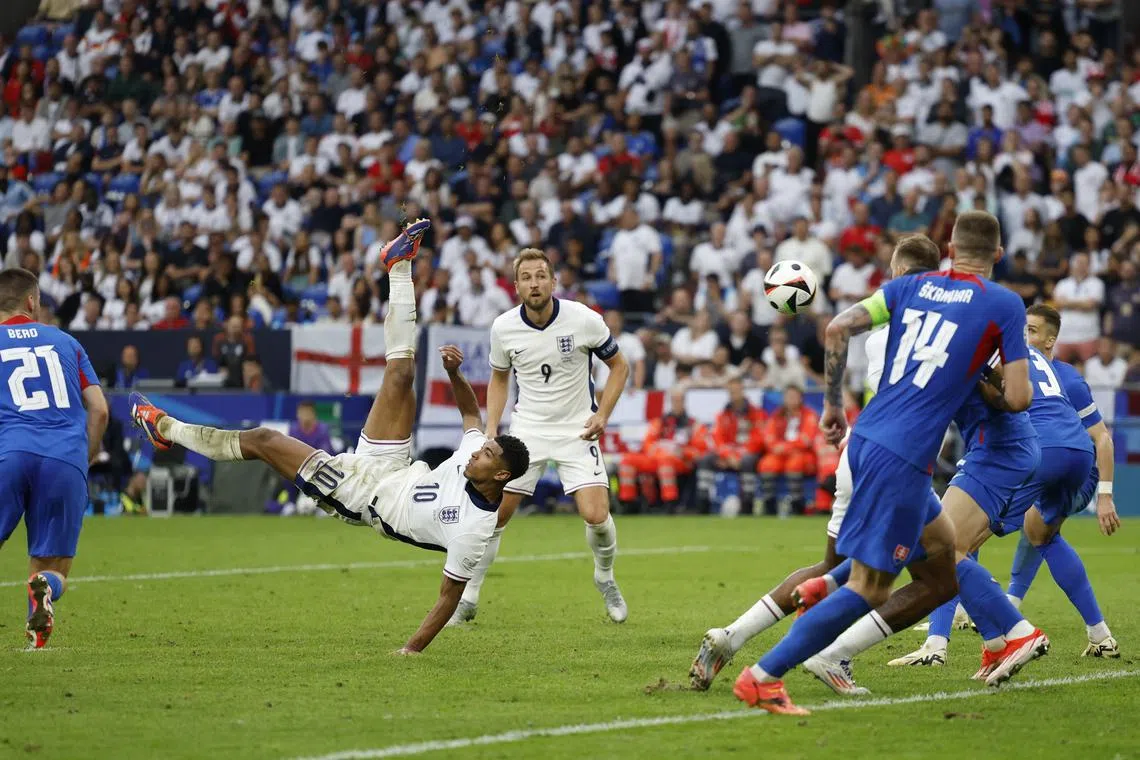 Soccer Football - Euro 2024 - Round of 16 - England v Slovakia - Arena AufSchalke, Gelsenkirchen, Germany - June 30, 2024 England's Jude Bellingham scores their first goal REUTERS/John Sibley