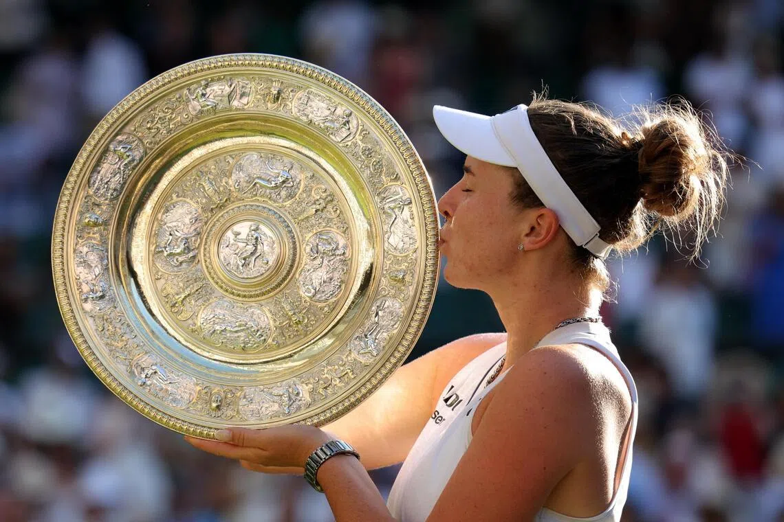 Linda Noskova of the Czech Republic celebrates with the trophy after winning her Wimbledon final against compatriot Karolina Muchova.