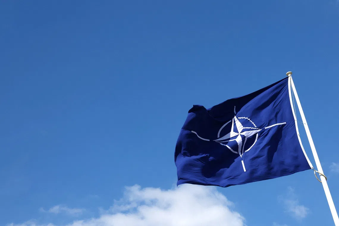 FILE PHOTO: A NATO flag flutters at NATO headquarters in Brussels, Belgium April 2, 2025. REUTERS/Yves Herman/File Photo