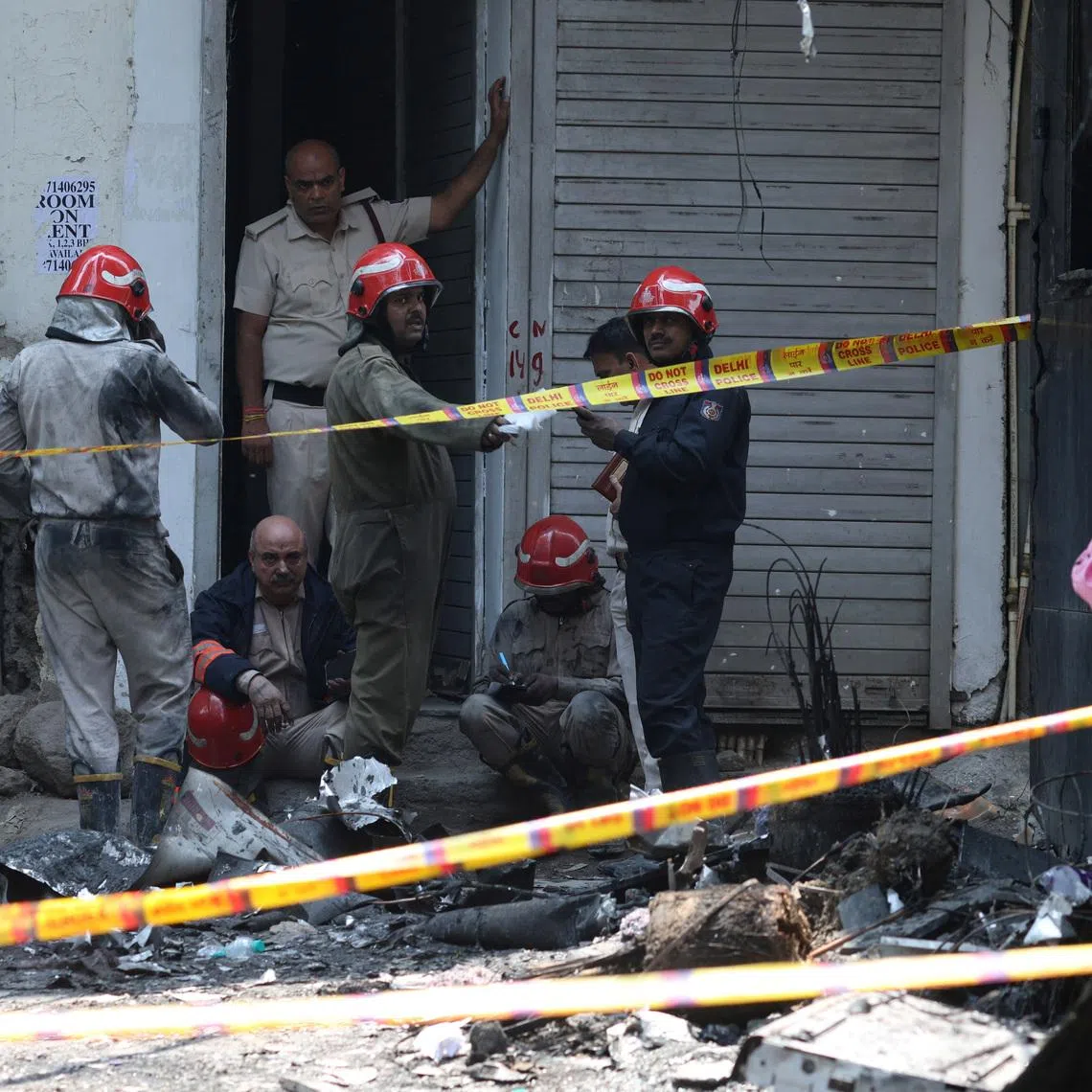 Firefighters at work after a fire at a hotel in New Delhi, India, on June 3.