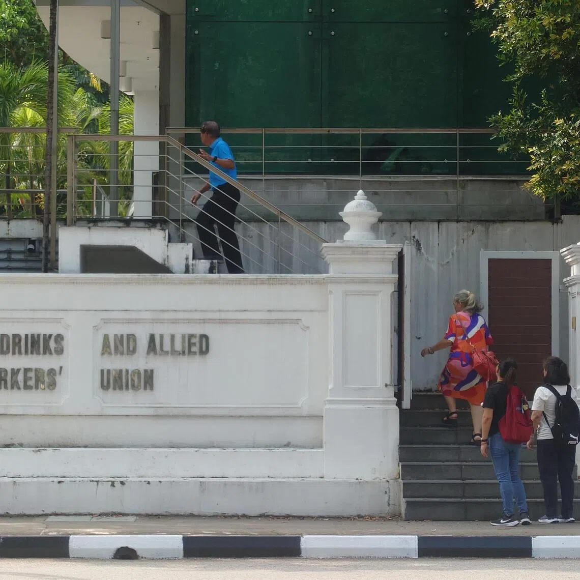 bncupcakes04 - Staff of shuttered Twelve Cupcakes arrive at the office of the Food, Drinks and Allied Workers Union on Nov 4 to meet with union representatives. 

Credit: BENJAMIN LIM