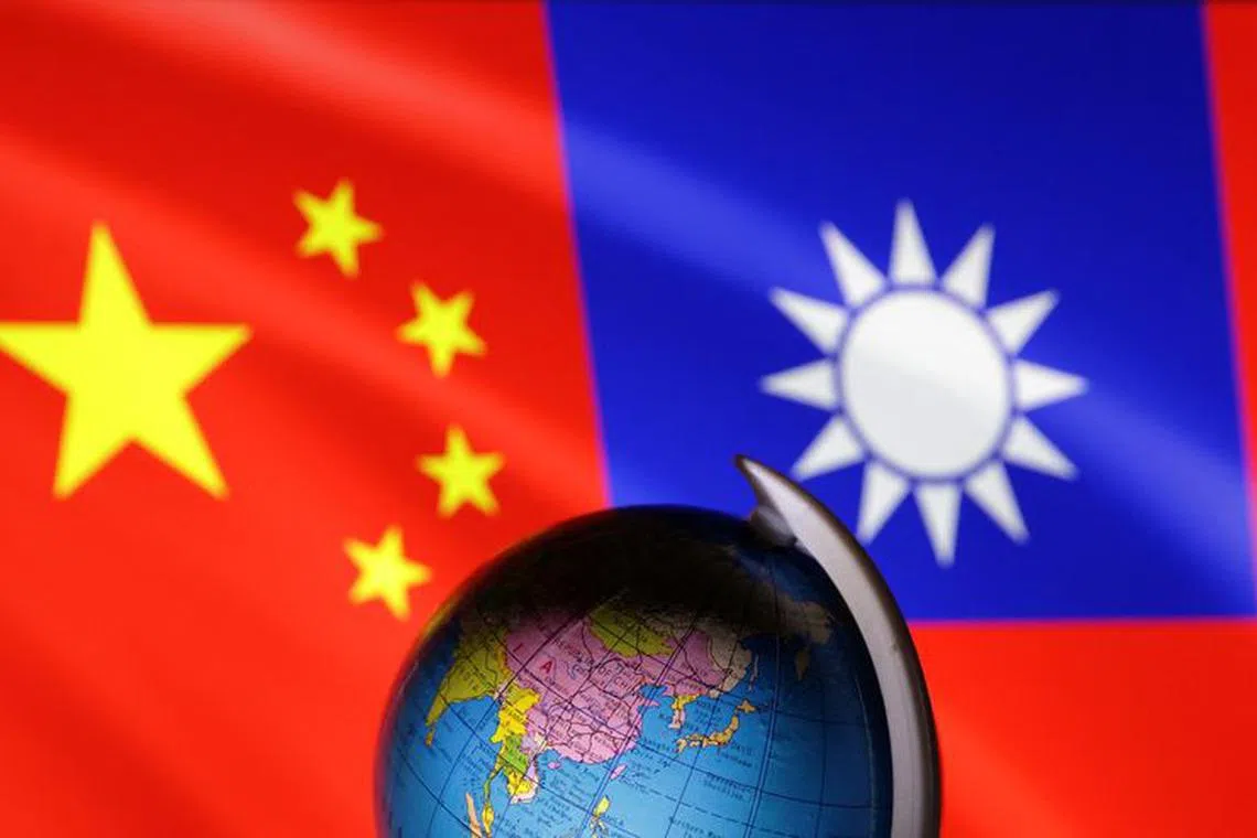 A globe is seen in front of Chinese and Taiwanese flags in this illustration, August 6, 2022. REUTERS/Dado Ruvic/Illustration/file photo