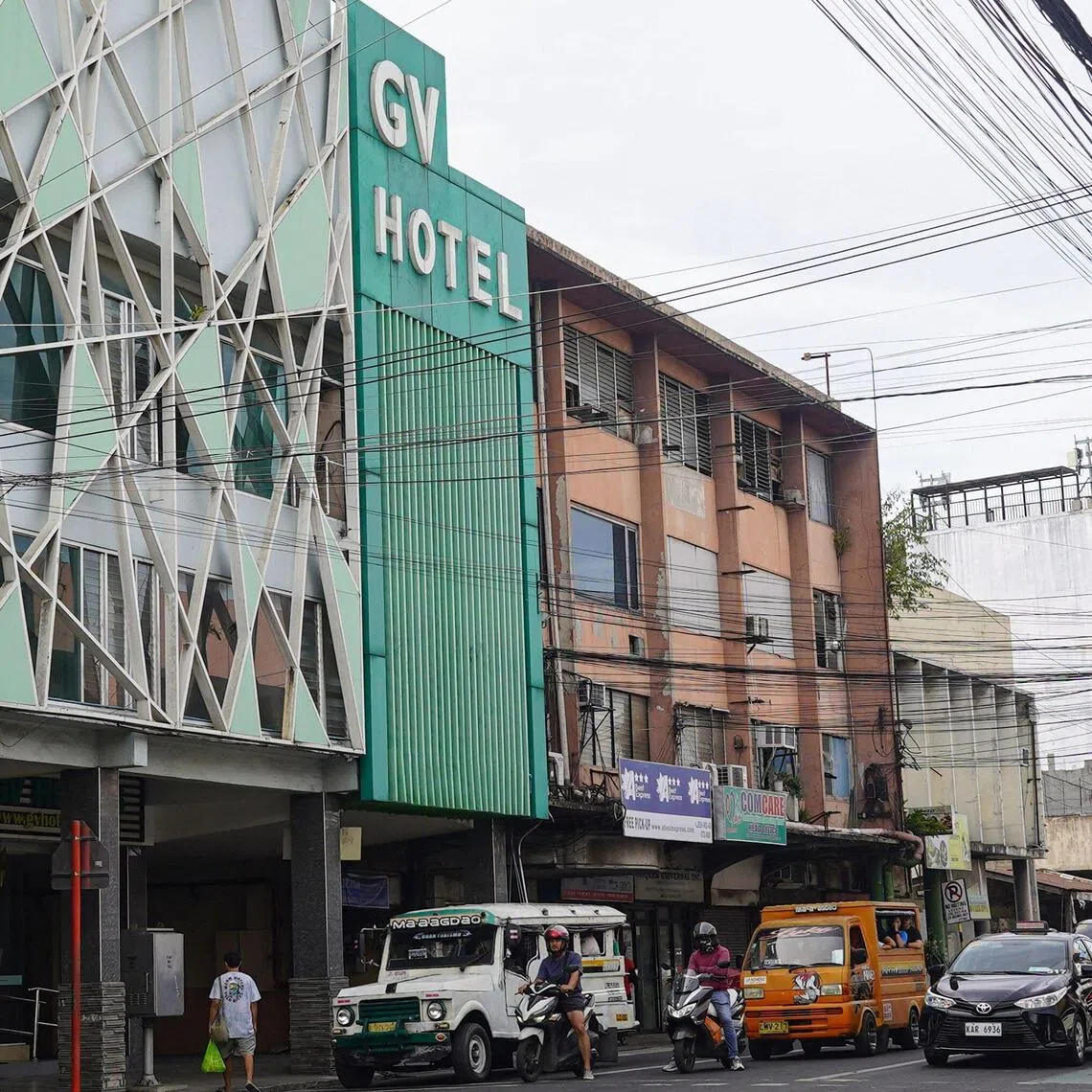 The facade of GV hotel is seen in Davao City, in the Philippines' southern island of Mindanao, where father-and-son duo Sajid and Naveed Akram stayed during their visit in November, weeks before they allegedly killed 15 people on Bondi Beach in Australia. Australian police are investigating whether the pair met with Islamist extremists during a visit to the Philippines weeks before the shooting. (Photo by Ferdinandh CABRERA / AFP)