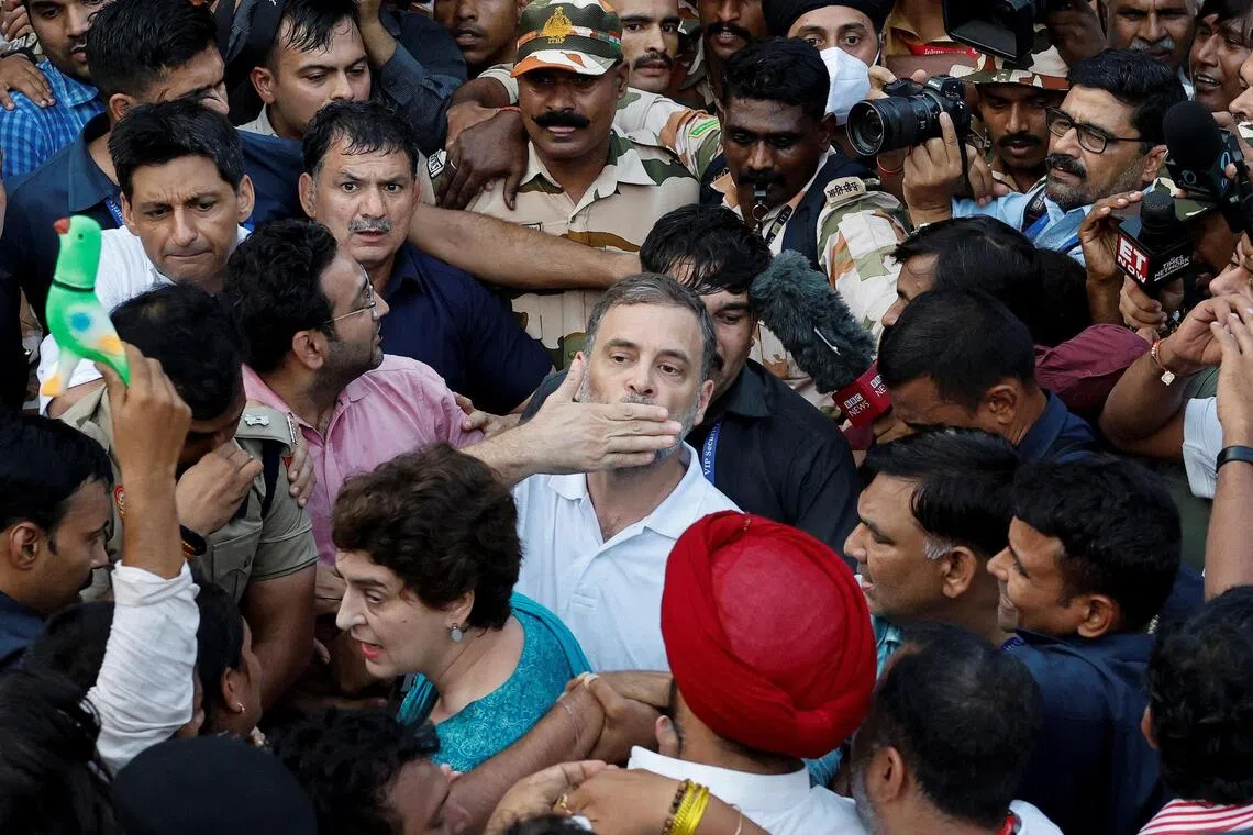 Police detaining Indian opposition leader Rahul Gandhi and his sister Priyanka Gandhi Vadra during a protest in New Delhi on Oct 7.
