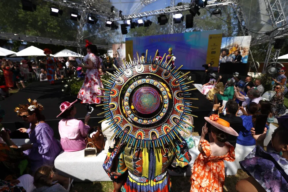 Participants in the 'Fashions on the Field' are seen during Melbourne Cup Day at Flemington Racecourse in Melbourne, Australia on Nov 7, 2023. 