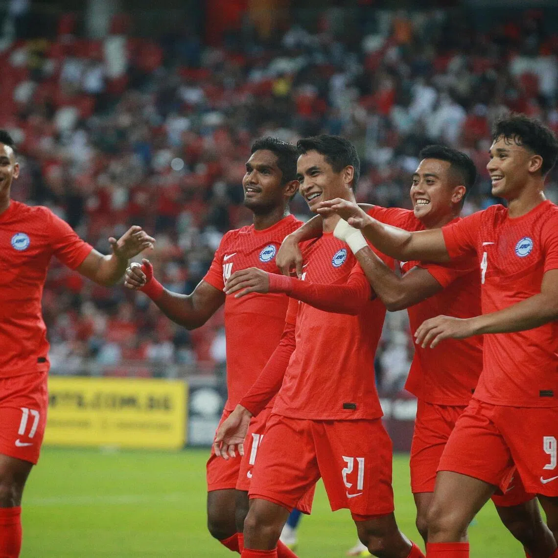 Singapore’s Safuwan Baharudin (No. 21) and Ikhsan Fandi (No. 9), seen here celebrating in a friendly in 2022 alongside (from left) Irfan Fandi, Hariss Harun and Amy Recha.