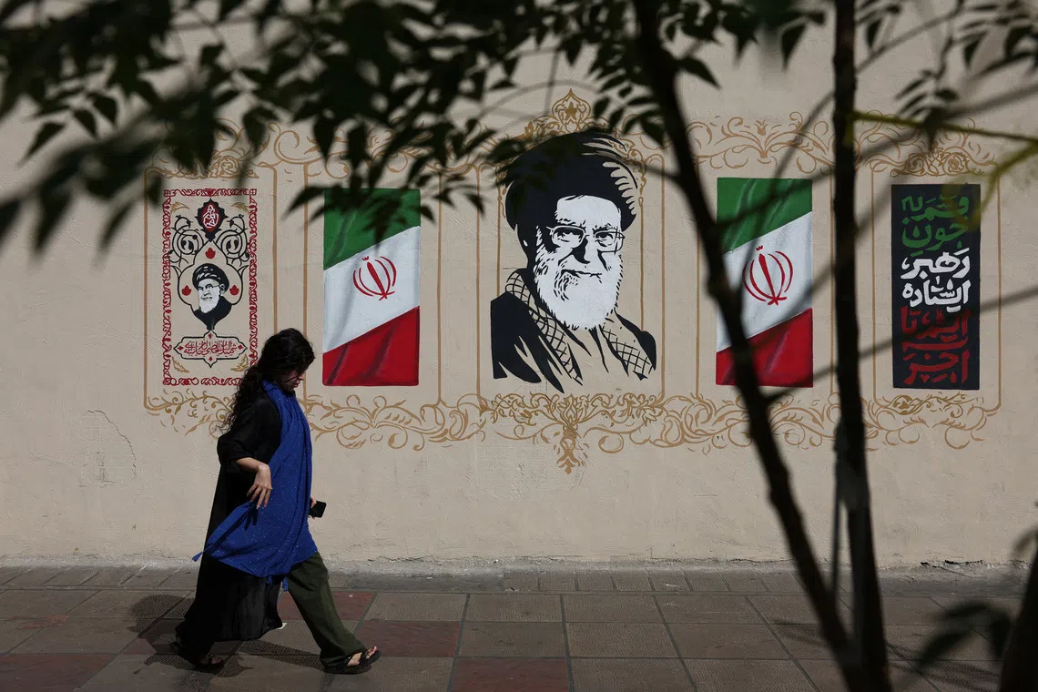 A woman walks by a mural depicting Iran's late Supreme Leader Ayatollah Ali Khamenei, on a street in Tehran, Iran, September 2, 2026. Majid Asgaripour/WANA (West Asia News Agency) via REUTERS