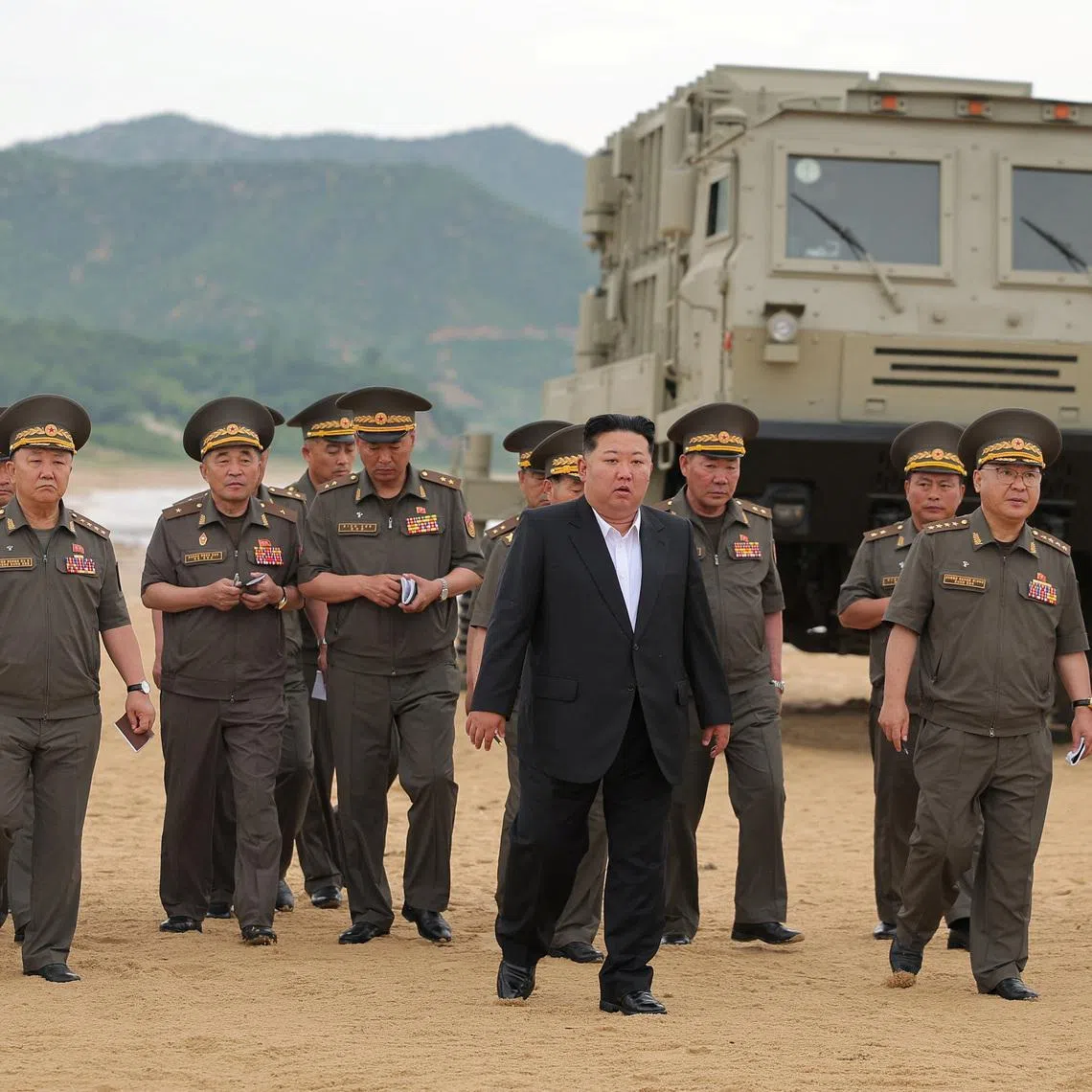 North Korean leader Kim Jong Un oversees the test of key weapons in North Korea on June 25.