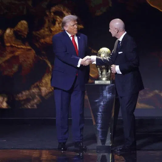 FIFA president Gianni Infantino presents US President Donald Trump with the FIFA Peace Prize during the 2026 World Cup draw in Washington, US.
