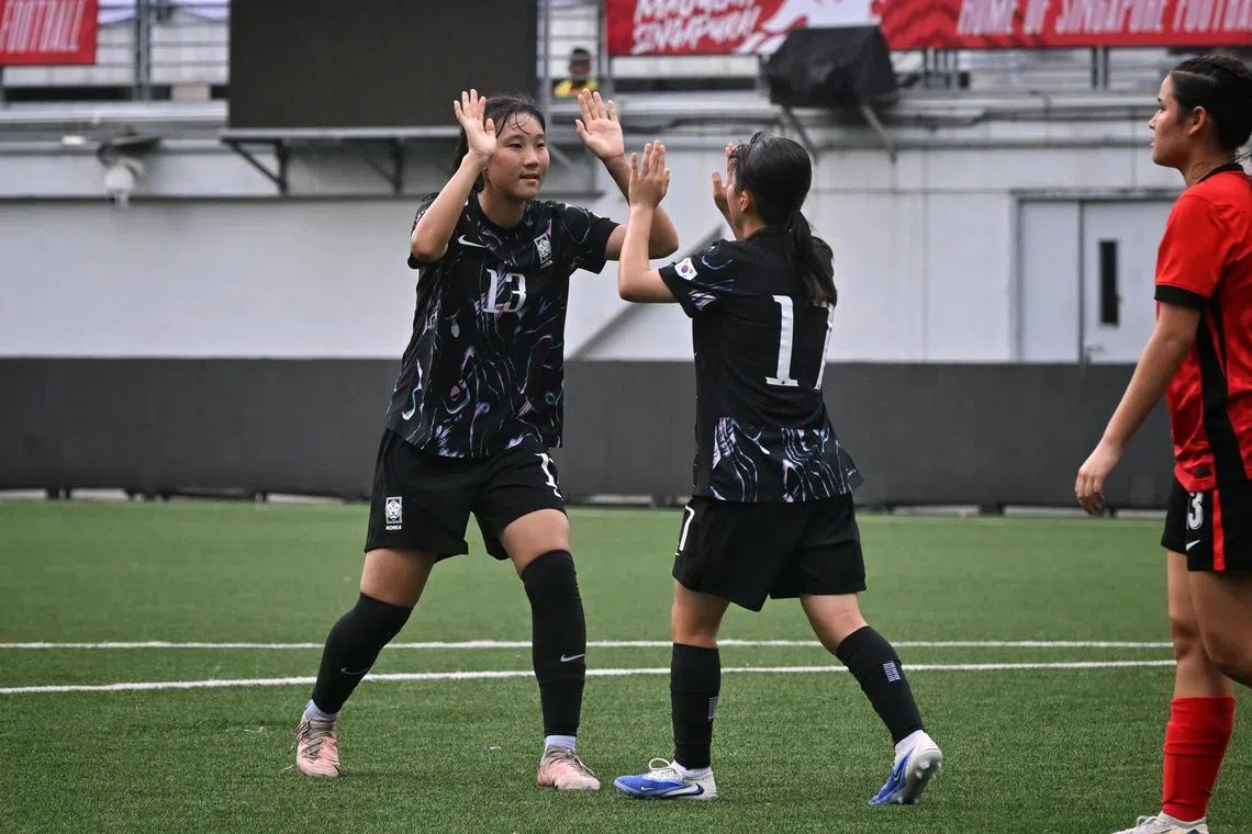 South Korean striker Cho An (extreme left) celebrating a goal with her teammate Son Seo-hyeon (second from left) in the team's 8-1 Lion City Cup victory over Hong Kong on July 12, 2025.