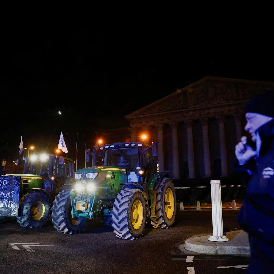 Tractors line up in front of the National Assembly as French farmers protest against the government's handling of the EU-Mercosur free trade agreement and lumpy skin disease outbreak, in Paris, France, January 13, 2026. REUTERS/Benoit Tessier