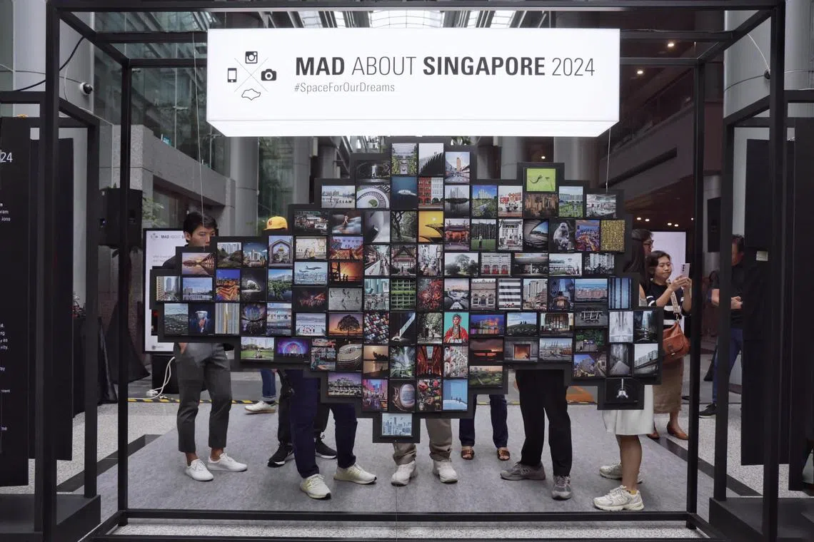 Guests at the exhibition launch of Mad About Singapore 2024 campaign, co-organised by URA and InstaSG under the theme Space For Our Dreams, at URA Centre on June 22, 2024. ST PHOTO: KEVIN LIM arinsta22