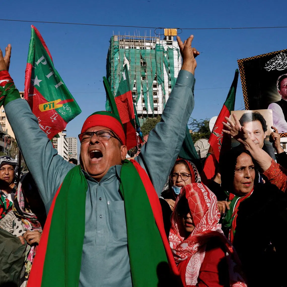 FILE PHOTO: Supporters of former Prime Minister Imran Khan's party, the Pakistan Tehreek-e-Insaf (PTI), chant slogans as they gather during a protest demanding free and fair results of the elections, outside the provincial election commission office in Karachi, Pakistan February 17, 2024. REUTERS/Akhtar Soomro/File Photo