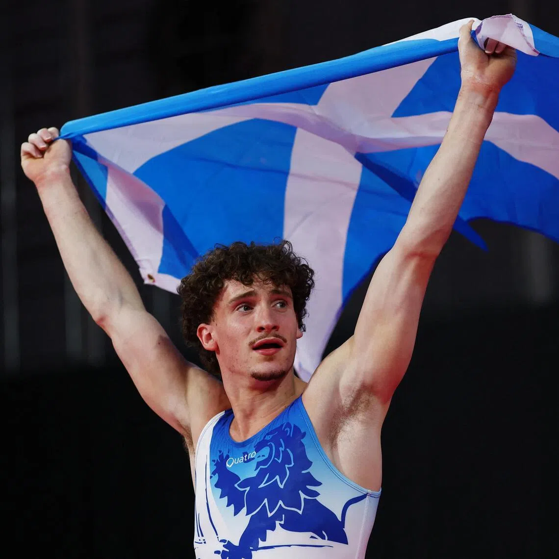 Scotland’s Reuben Ward celebrates after winning the gold medal in men’s all-around final on July 26.