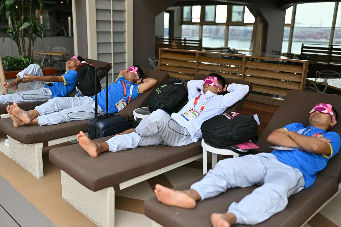 Athletes relax on the Costa Serena cruise ship where Asian Games competitors and team members are staying, in Nagoya on Sept 25.