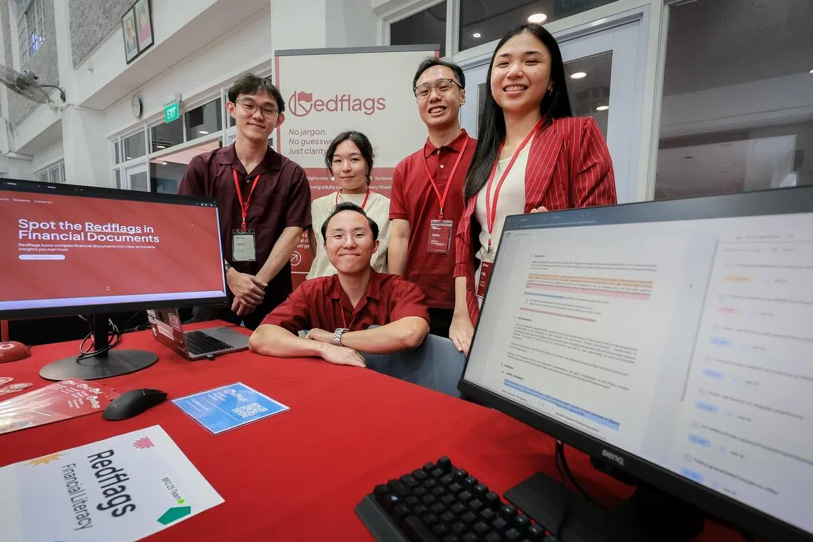 Redflags’ team members (front, then from left)  
Danny Lim, 
Jonus Ho, 
Jessica Olivia Pandjang, 
Justin Yeo, 
Teo Yi Ki, 
and Zhou Zibo (not in picture) 
at their booth at the Build For Good Accelerator Finale event held at Tanglin  Community Club on Sep 6, 2025.