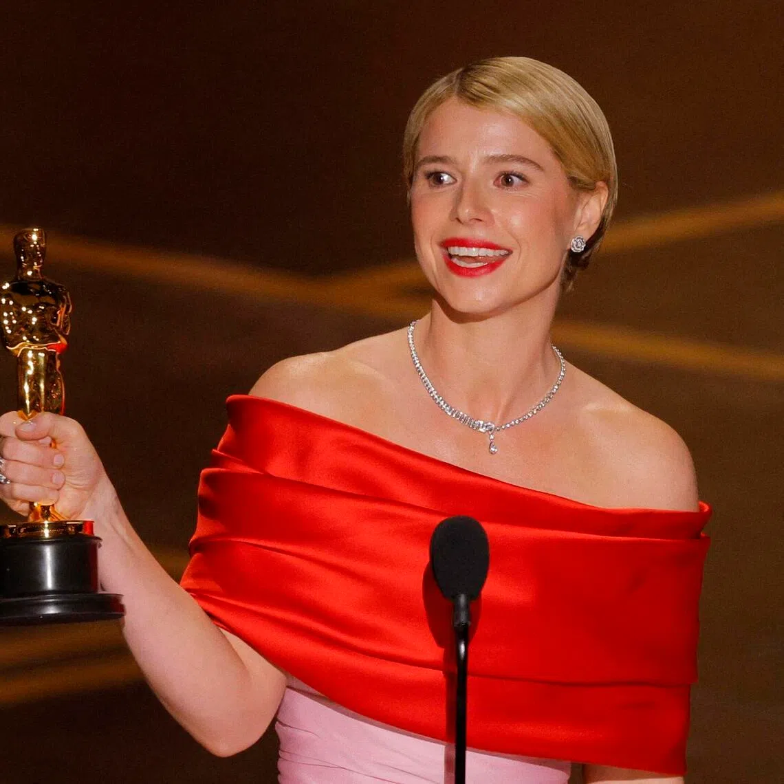 Jessie Buckley speaks on stage after winning the Oscar for Best Actress for Hamnet during the Oscars show on March 15.
