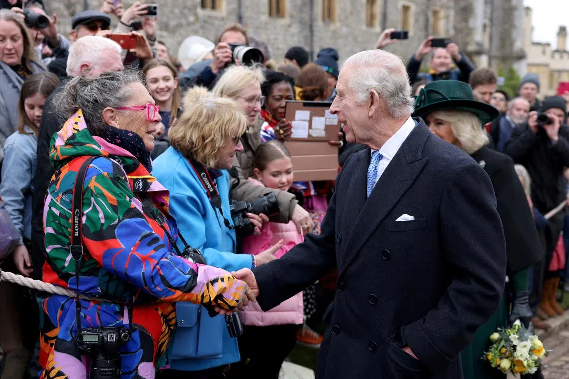 FILE PHOTO: Britain's King Charles and Queen Camilla greet people after attending the Easter Matins Service at St. George's Chapel, Windsor Castle, Britain March 31, 2024. REUTERS/Hollie Adams/Pool/File Photo