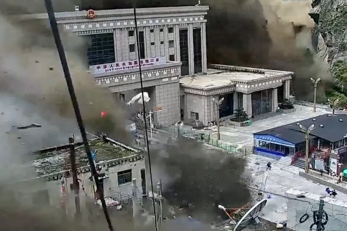 A CCTV footage shows people running away as wall of mud and water destroys buildings in a valley at Nepal-China border, in Gyirong, Tibet region, China August 26, 2026, in this screengrab obtained from a social media video. SOCIAL MEDIA/via REUTERS THIS IMAGE HAS BEEN SUPPLIED BY A THIRD PARTY. NO RESALES. NO ARCHIVES. NEWS USE ONLY. VERIFICATION: - Buildings, river, road layout and terrain matched archive and satellite imagery on Tibet-China border - Coordinates: 28.280317840785155, 85.37761006909693 - Date confirmed by timestamp of the CCTV footage - Both Nepali and Chinese government reported on the mudslide - Rasuwa district administrator told Reuters that there could be heavy casualties or loss of property on August 26 - Chinese President Xi Jinping urged "all-out" search efforts for the missing as well as stronger monitoring and early warning systems to prevent secondary disasters on August 26 TPX IMAGES OF THE DAY